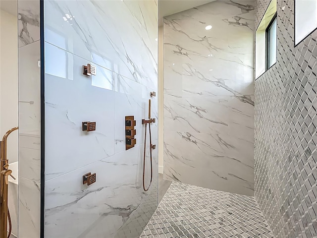 1167 Boundary Blvd, Rotonda West, FL 33947 - bathroom featuring a marble finish shower and plenty of natural light