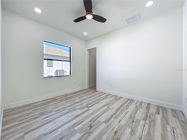 1167 Boundary Blvd, Rotonda West, FL 33947 - unfurnished room with light wood finished floors, ceiling fan, and recessed lighting