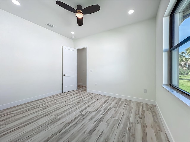 1167 Boundary Blvd, Rotonda West, FL 33947 - spare room featuring a ceiling fan, light wood-style floors, and recessed lighting
