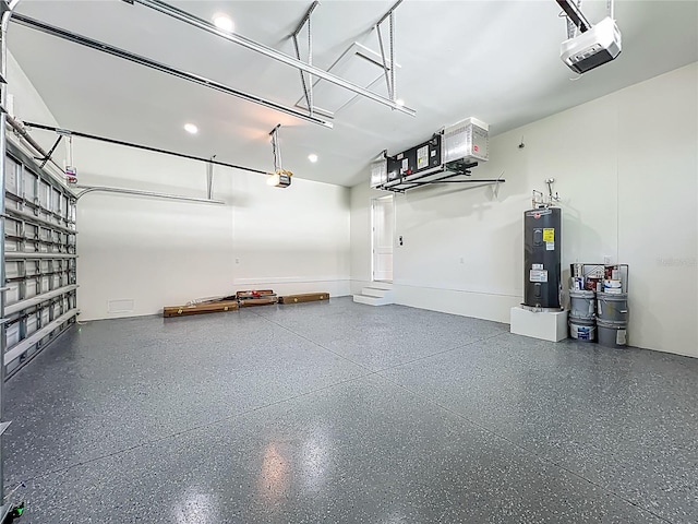 1167 Boundary Blvd, Rotonda West, FL 33947 - garage with water heater and a garage door opener