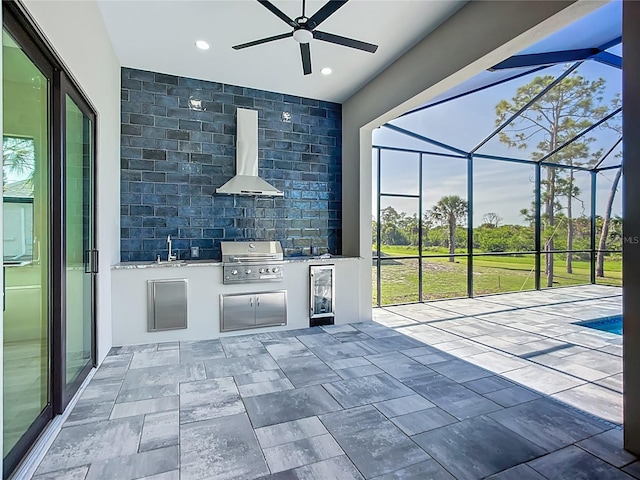 1167 Boundary Blvd, Rotonda West, FL 33947 - view of patio featuring an outdoor kitchen, ceiling fan, and a lanai