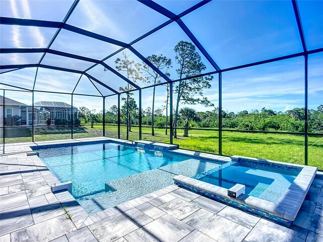 1167 Boundary Blvd, Rotonda West, FL 33947 - view of pool featuring a yard, a pool with connected hot tub, a lanai, a patio area, and view of wooded area