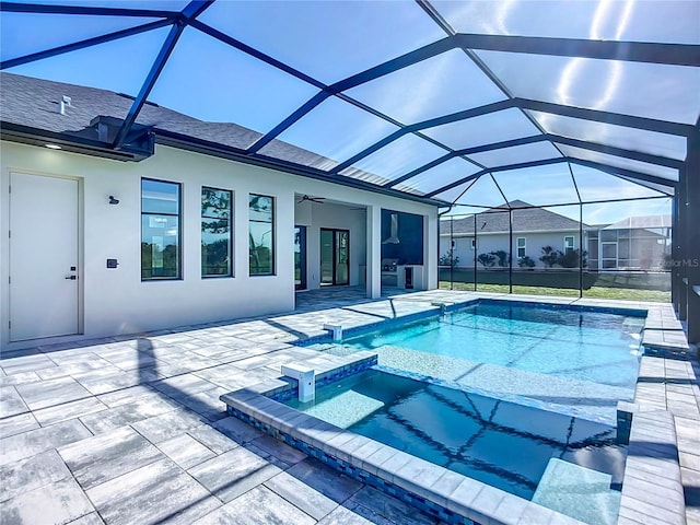 1167 Boundary Blvd, Rotonda West, FL 33947 - view of swimming pool with a patio area, a ceiling fan, a pool with connected hot tub, and a lanai