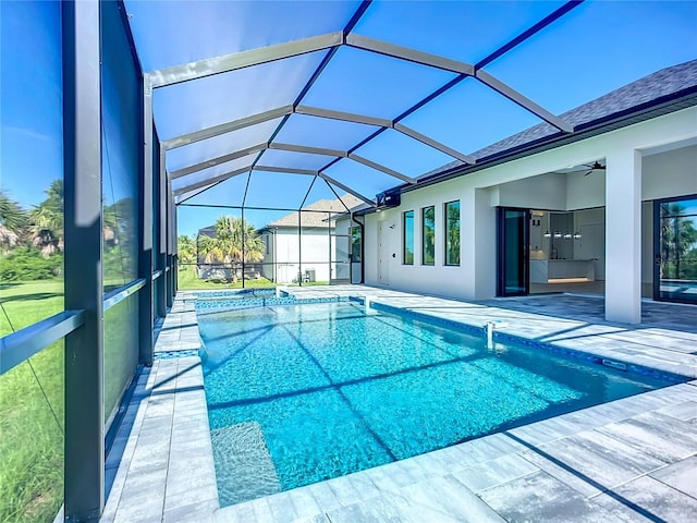 1167 Boundary Blvd, Rotonda West, FL 33947 - swimming pool with a patio area, a ceiling fan, and glass enclosure