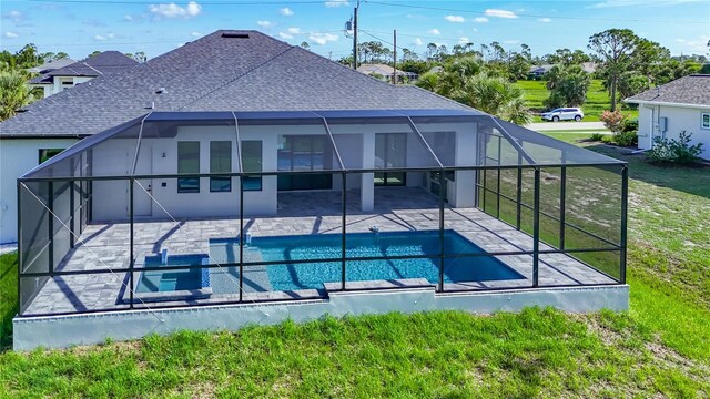 1167 Boundary Blvd, Rotonda West, FL 33947 - rear view of house with a patio area, a shingled roof, a yard, an outdoor pool, and a lanai