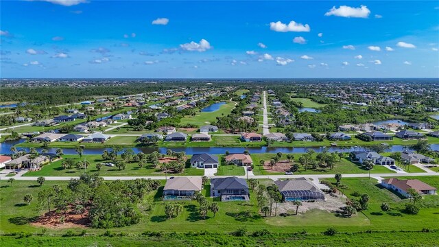1167 Boundary Blvd, Rotonda West, FL 33947 - aerial perspective of suburban area featuring a nearby body of water