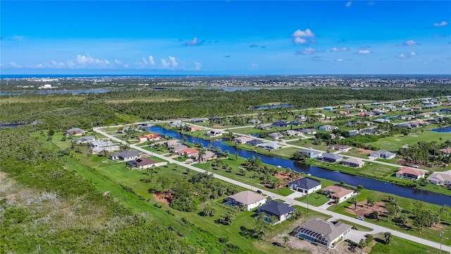 1167 Boundary Blvd, Rotonda West, FL 33947 - aerial perspective of suburban area with a large body of water