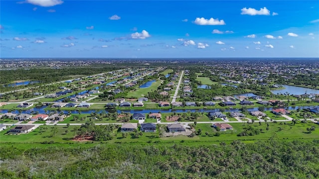 1167 Boundary Blvd, Rotonda West, FL 33947 - aerial perspective of suburban area with a large body of water