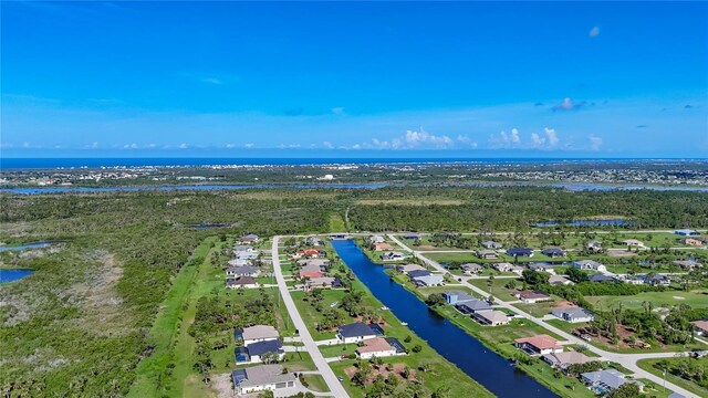 1167 Boundary Blvd, Rotonda West, FL 33947 - aerial view of residential area with a large body of water