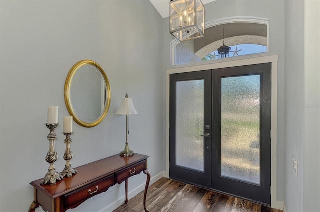 7302 Dunes Ct, Bradenton, FL 34202 - foyer entrance with french doors, dark wood finished floors, and a chandelier
