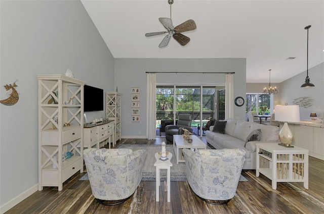 7302 Dunes Ct, Bradenton, FL 34202 - living area featuring ceiling fan, dark wood-style floors, a chandelier, and vaulted ceiling