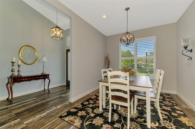 7302 Dunes Ct, Bradenton, FL 34202 - dining space with a chandelier, wood finished floors, and lofted ceiling