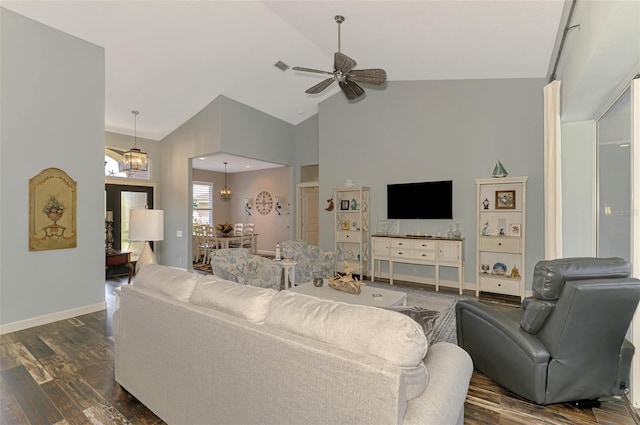 7302 Dunes Ct, Bradenton, FL 34202 - living area with dark wood-style flooring, ceiling fan, a chandelier, and high vaulted ceiling