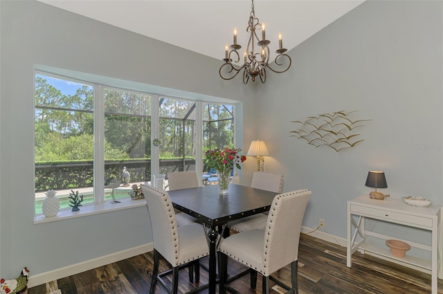 7302 Dunes Ct, Bradenton, FL 34202 - dining room featuring a chandelier, dark wood-type flooring, and vaulted ceiling
