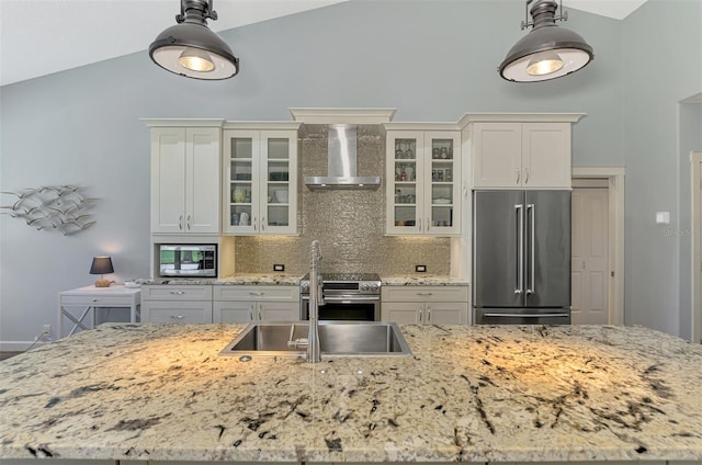 7302 Dunes Ct, Bradenton, FL 34202 - kitchen featuring stainless steel appliances, wall chimney range hood, vaulted ceiling, tasteful backsplash, and decorative light fixtures