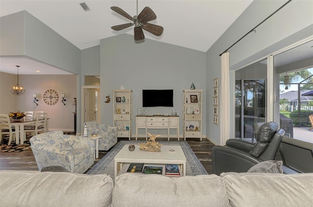 7302 Dunes Ct, Bradenton, FL 34202 - living room featuring wood finished floors, a ceiling fan, high vaulted ceiling, and a chandelier