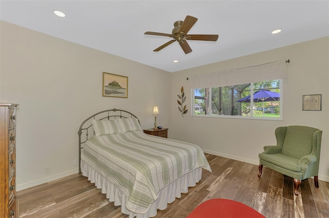 7302 Dunes Ct, Bradenton, FL 34202 - bedroom with wood finished floors, recessed lighting, and ceiling fan