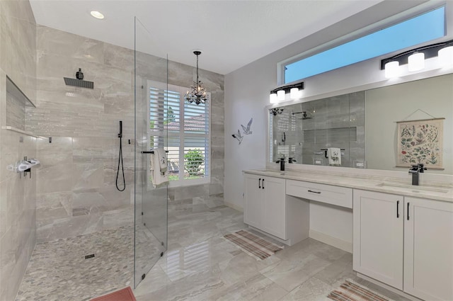 7302 Dunes Ct, Bradenton, FL 34202 - bathroom with marble tiled floors, double vanity, walk in shower, plenty of natural light, and recessed lighting