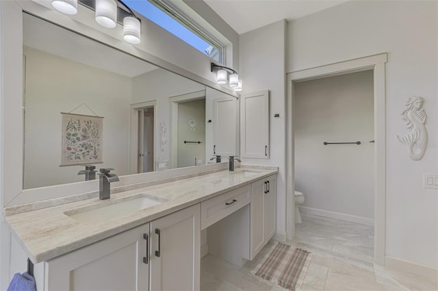 7302 Dunes Ct, Bradenton, FL 34202 - bathroom with double vanity and toilet