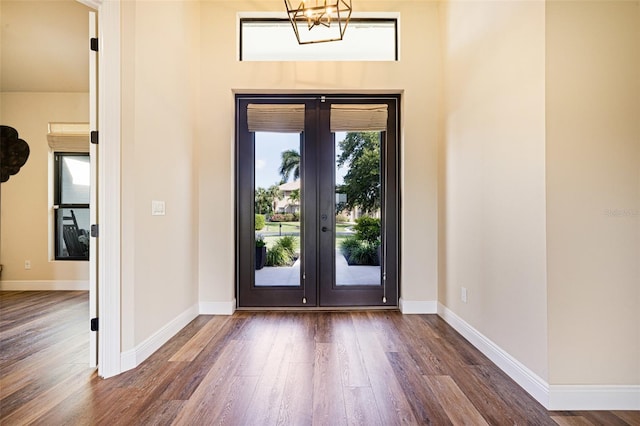 16630 Willow Point Ct, Alva, FL 33920 - foyer entrance featuring french doors, wood finished floors, and baseboards