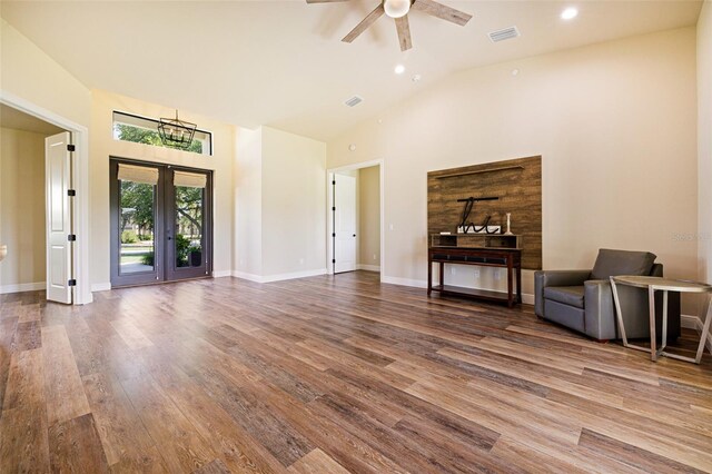 16630 Willow Point Ct, Alva, FL 33920 - living room with wood finished floors, ceiling fan, high vaulted ceiling, recessed lighting, and baseboards