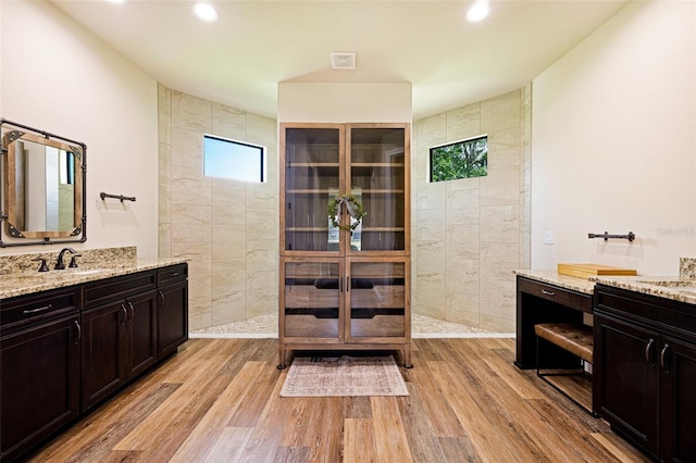 16630 Willow Point Ct, Alva, FL 33920 - full bathroom with vanity, a walk in shower, wood finished floors, and recessed lighting