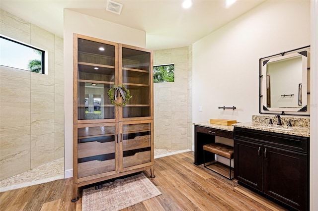 16630 Willow Point Ct, Alva, FL 33920 - full bathroom featuring wood finished floors, vanity, walk in shower, and recessed lighting