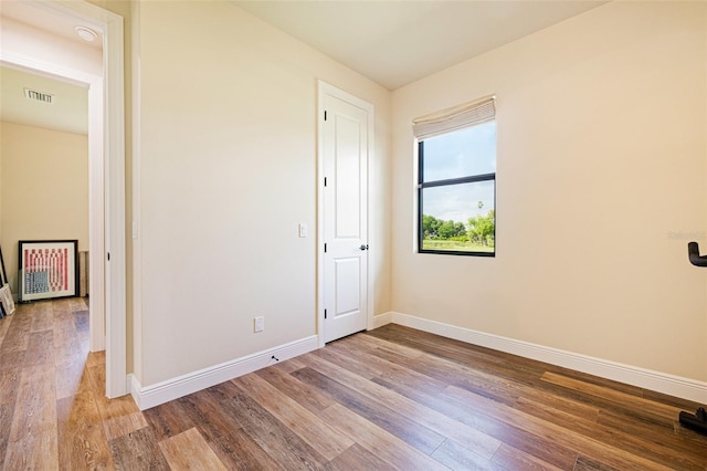 16630 Willow Point Ct, Alva, FL 33920 - unfurnished bedroom with wood finished floors and baseboards