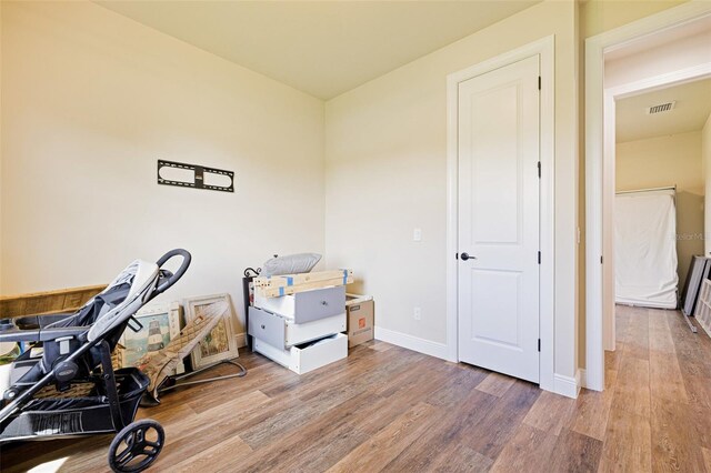 16630 Willow Point Ct, Alva, FL 33920 - exercise room with light wood-style flooring and baseboards