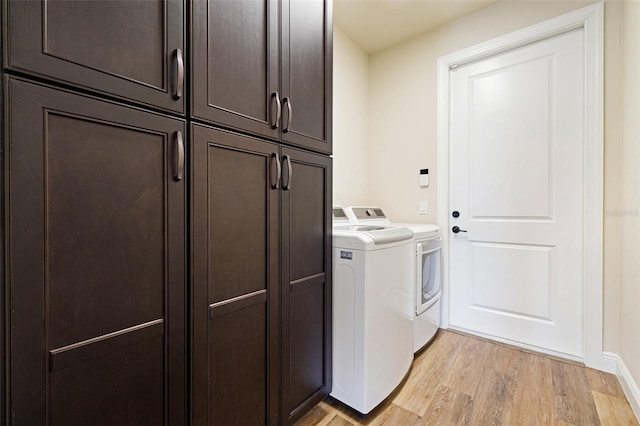 16630 Willow Point Ct, Alva, FL 33920 - laundry area featuring light wood finished floors, separate washer and dryer, cabinet space, and baseboards