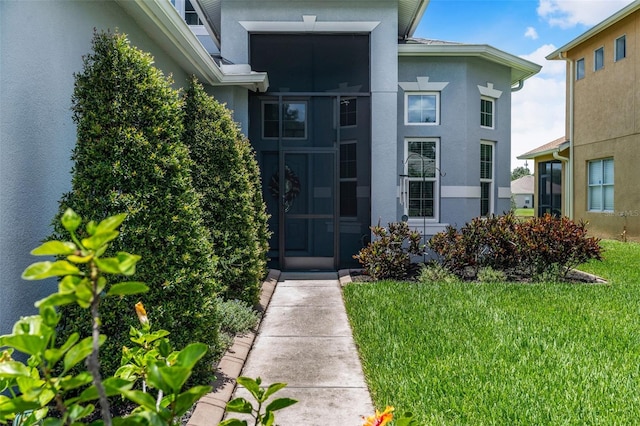 2347 123rd Pl E, Parrish, FL 34219 - entrance to property featuring stucco siding and a yard