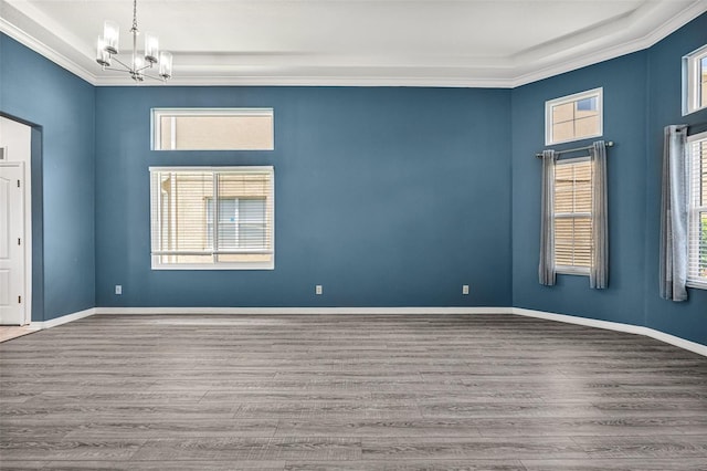 2347 123rd Pl E, Parrish, FL 34219 - spare room with a chandelier, wood finished floors, and ornamental molding