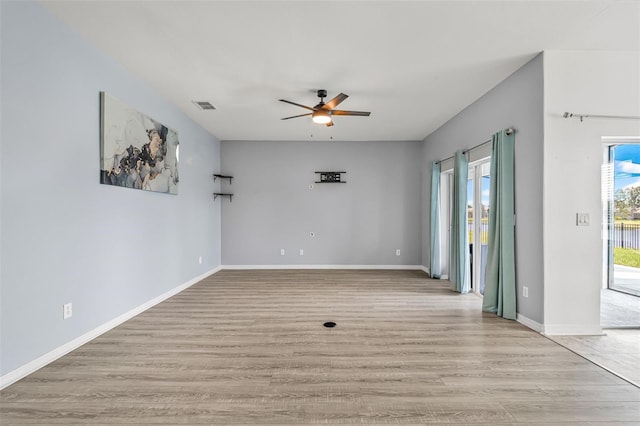 2347 123rd Pl E, Parrish, FL 34219 - empty room with a ceiling fan and light wood-type flooring