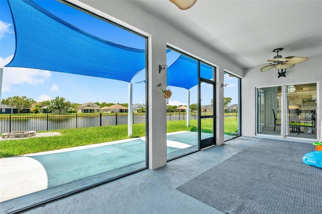 2347 123rd Pl E, Parrish, FL 34219 - unfurnished sunroom with ceiling fan, a water view, and an outdoor fire pit