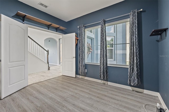 2347 123rd Pl E, Parrish, FL 34219 - unfurnished room with wood finished floors and arched walkways