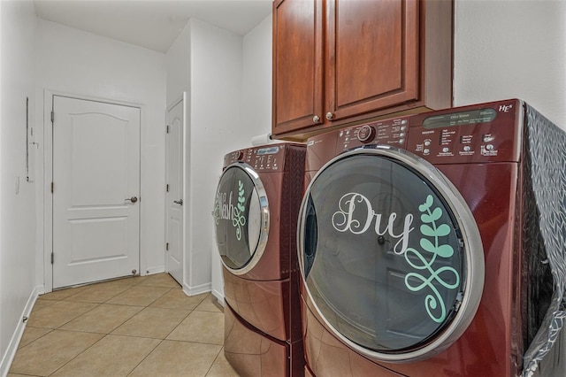 2347 123rd Pl E, Parrish, FL 34219 - laundry area with washer and dryer, cabinet space, and light tile patterned floors