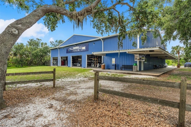 2347 123rd Pl E, Parrish, FL 34219 - view of front of house with an outbuilding, a detached garage, and an exterior structure