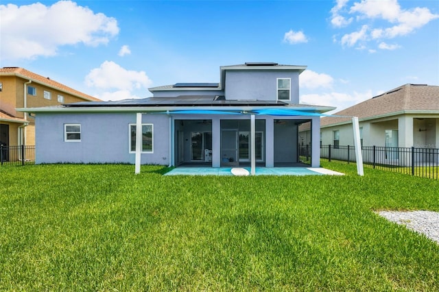 2347 123rd Pl E, Parrish, FL 34219 - rear view of property featuring roof mounted solar panels, stucco siding, a patio area, and a sunroom