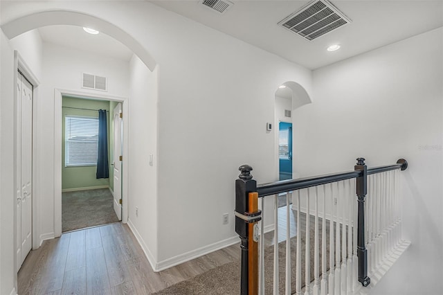 2347 123rd Pl E, Parrish, FL 34219 - hall with an upstairs landing, wood finished floors, arched walkways, and recessed lighting