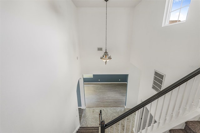 2347 123rd Pl E, Parrish, FL 34219 - stairs with a towering ceiling and wood finished floors