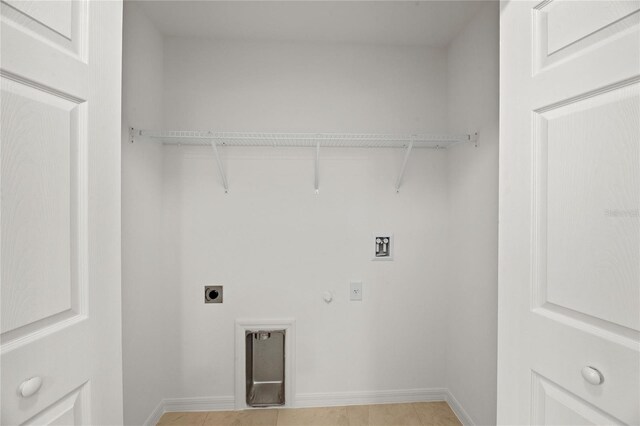 22033 Voltair Ave, Port Charlotte, FL 33954 - laundry room with electric dryer hookup, hookup for a gas dryer, hookup for a washing machine, and light tile patterned floors