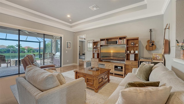 13220 Swiftwater Way, Lakewood Ranch, FL 34211 - living room with crown molding, light wood-style flooring, recessed lighting, and a raised ceiling
