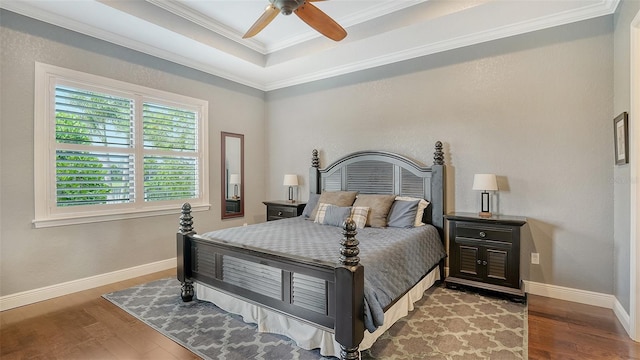 13220 Swiftwater Way, Lakewood Ranch, FL 34211 - bedroom with wood finished floors, ornamental molding, a raised ceiling, and a ceiling fan