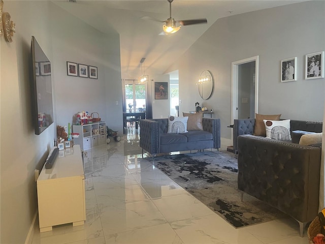 5848 Milton Ave, Sarasota, FL 34243 - living area with marble tiled flooring, a ceiling fan, and vaulted ceiling