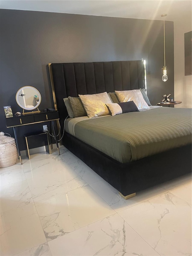 5848 Milton Ave, Sarasota, FL 34243 - bedroom featuring light marble finish floors