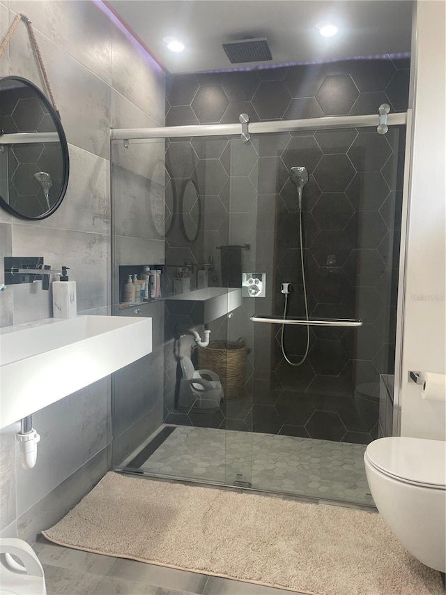 5848 Milton Ave, Sarasota, FL 34243 - bathroom with a stall shower and recessed lighting