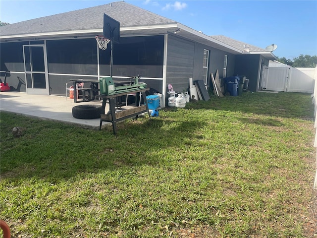 5848 Milton Ave, Sarasota, FL 34243 - back of property featuring a gate, roof with shingles, a patio, and a sunroom