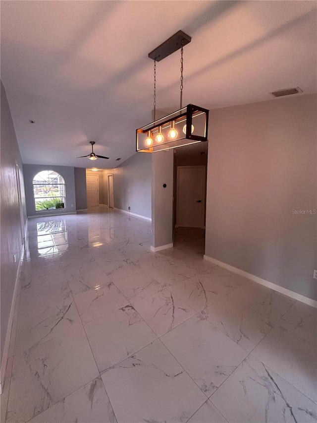 5848 Milton Ave, Sarasota, FL 34243 - empty room with a ceiling fan and light marble finish floors
