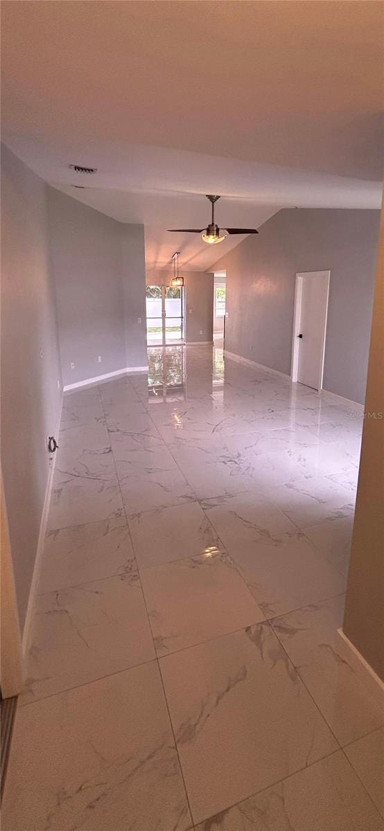 5848 Milton Ave, Sarasota, FL 34243 - unfurnished room with marble look tiles and ceiling fan