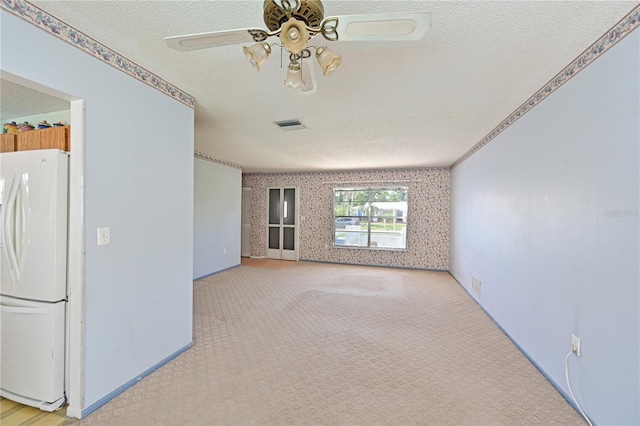 6406 16th Avenue Dr W, Bradenton, FL 34209 - spare room featuring a textured ceiling, a ceiling fan, and light carpet